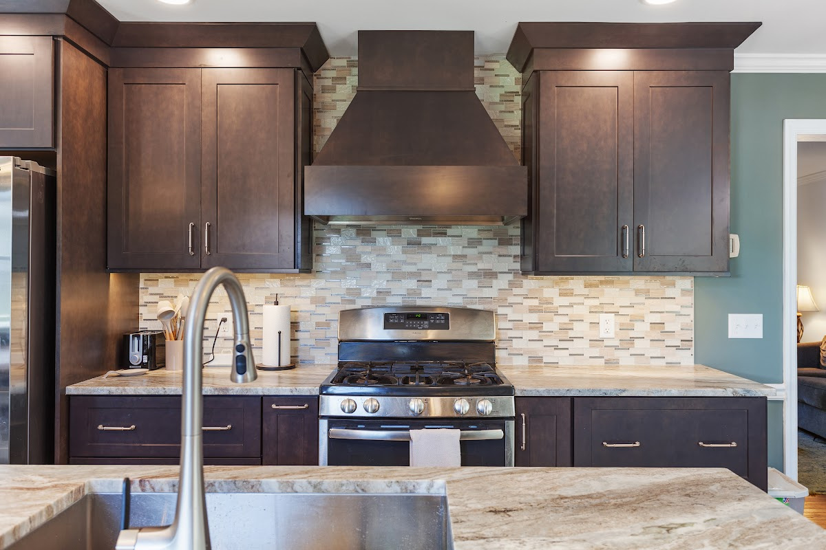 Dark stained kitchen cabinets in a galley kitchen space