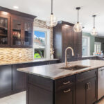 Dark stained kitchen cabinets in a galley kitchen space