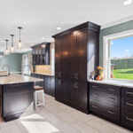Dark stained kitchen cabinets in a galley kitchen space