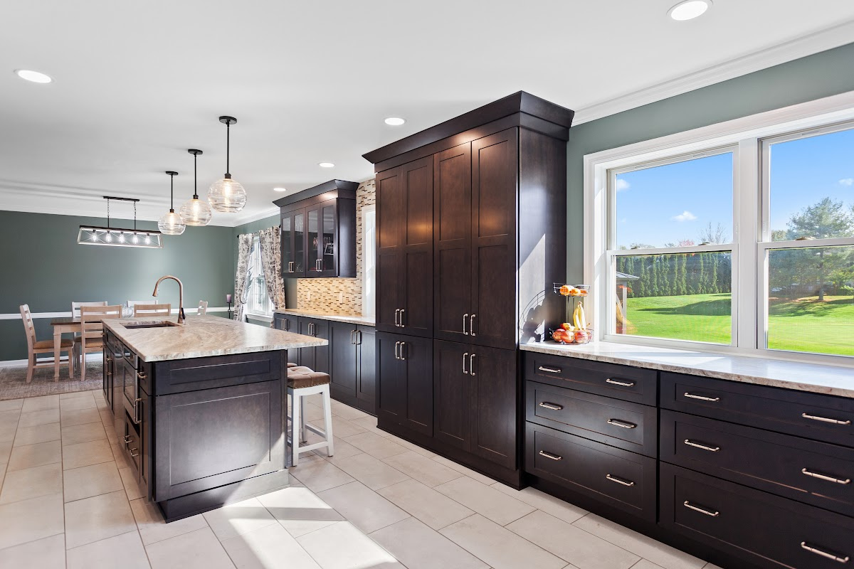 Dark stained kitchen cabinets in a galley kitchen space