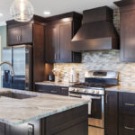 Dark stained kitchen cabinets in a galley kitchen space