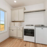 White painted laundry room cabinets