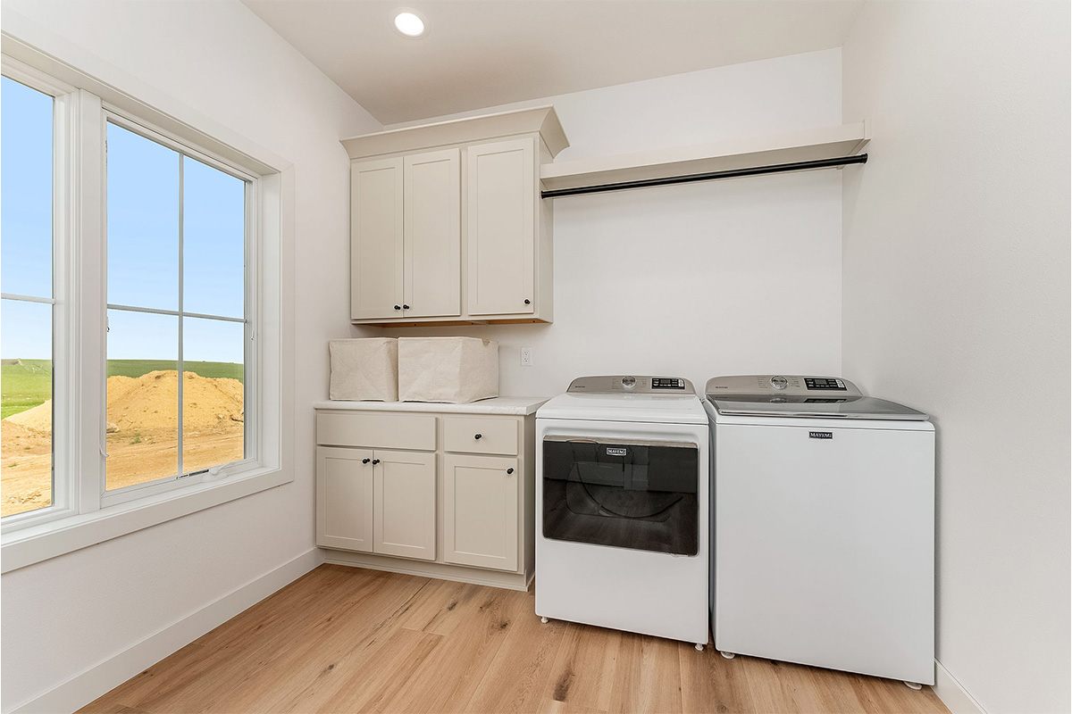 White painted laundry room cabinets