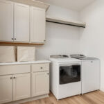 White painted laundry room cabinets