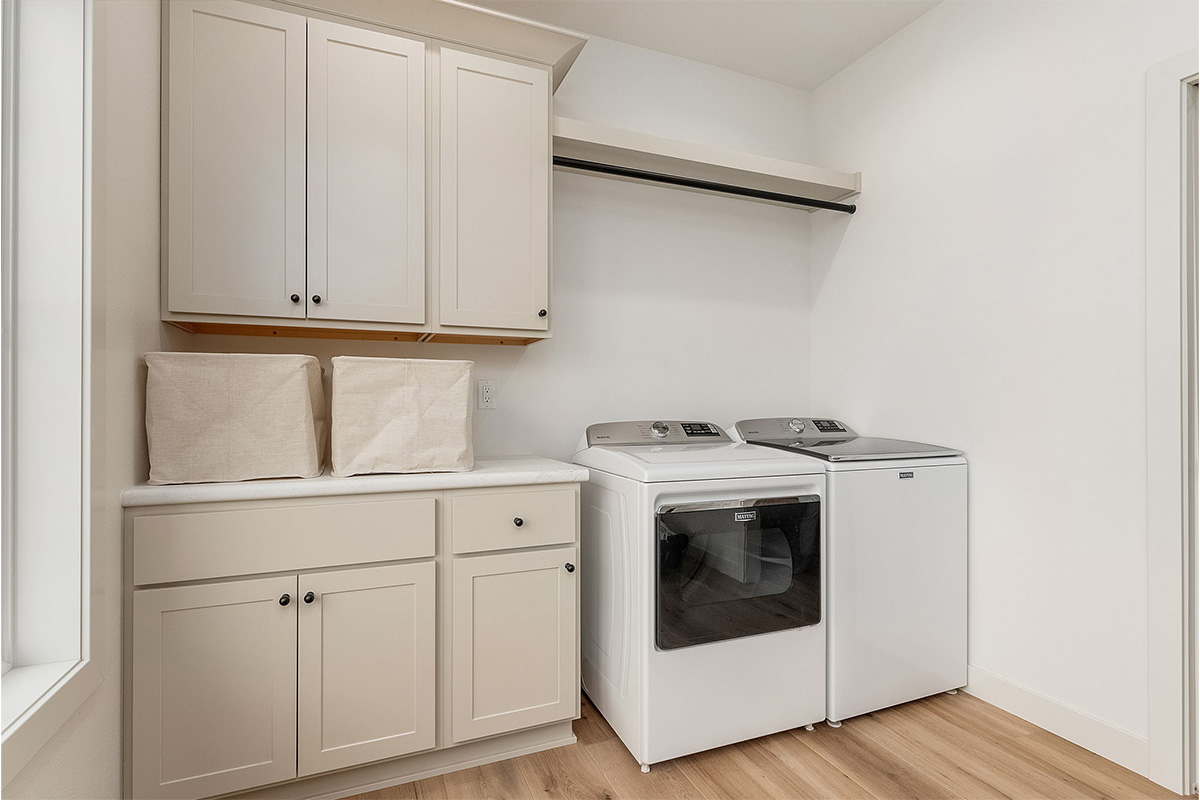 White painted laundry room cabinets