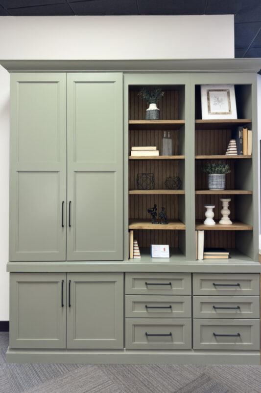 Showroom home library display featuring the Wren door painted with Moss Green.