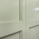 Showroom home library display featuring the Wren door painted with Moss Green.