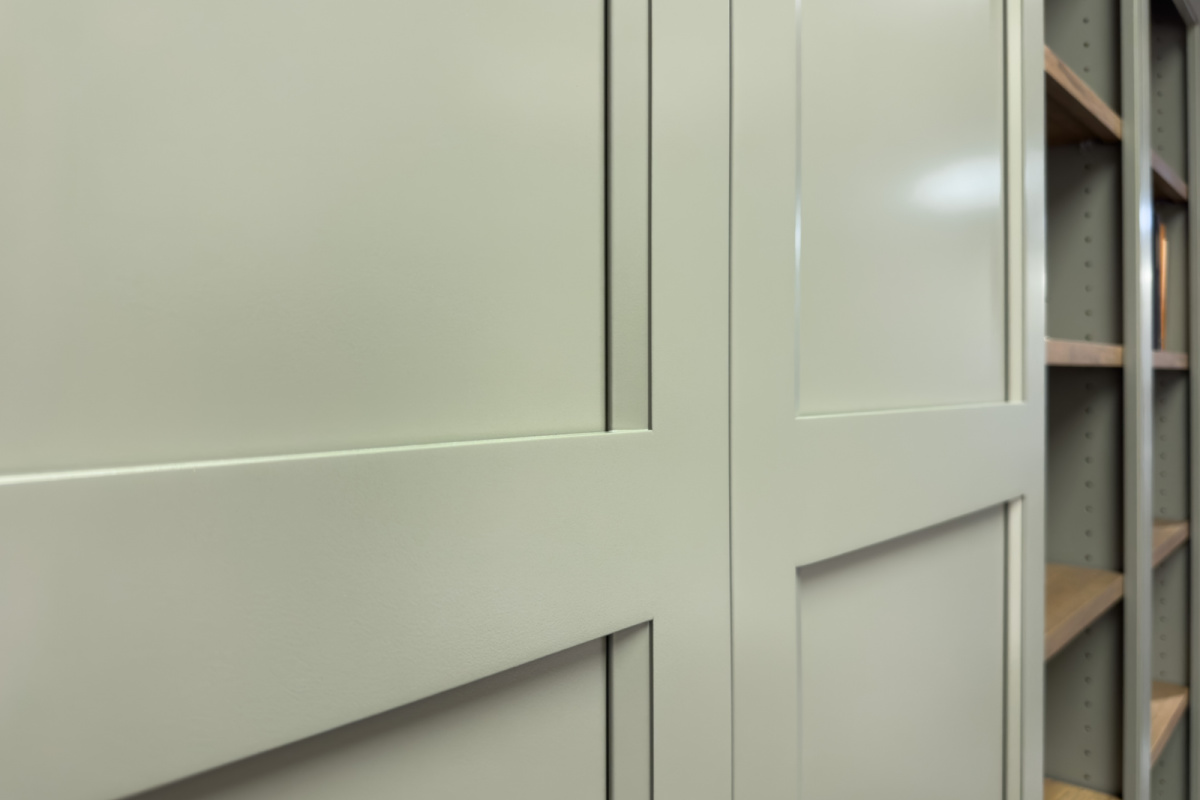 Showroom home library display featuring the Wren door painted with Moss Green.