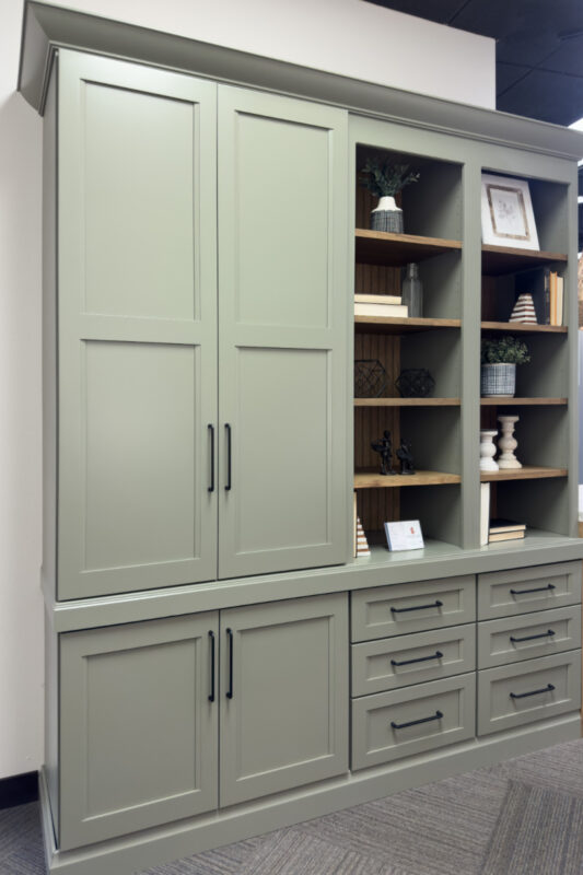 Showroom home library display featuring the Wren door painted with Moss Green.