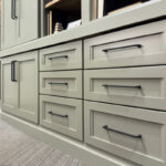 Showroom home library display featuring the Wren door painted with Moss Green.