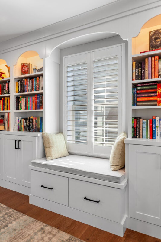 Reading nook with bench seat and bookcases on each side.