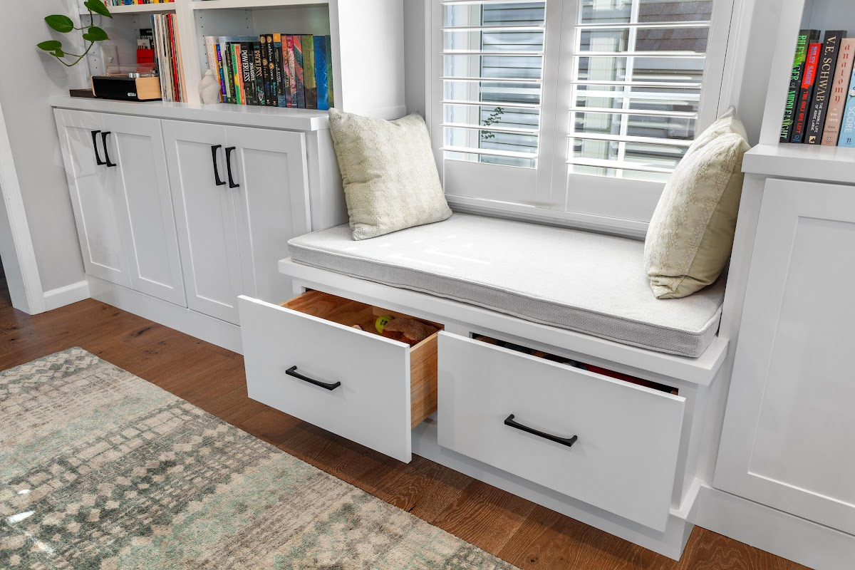 Reading nook with bench seat and bookcases on each side.