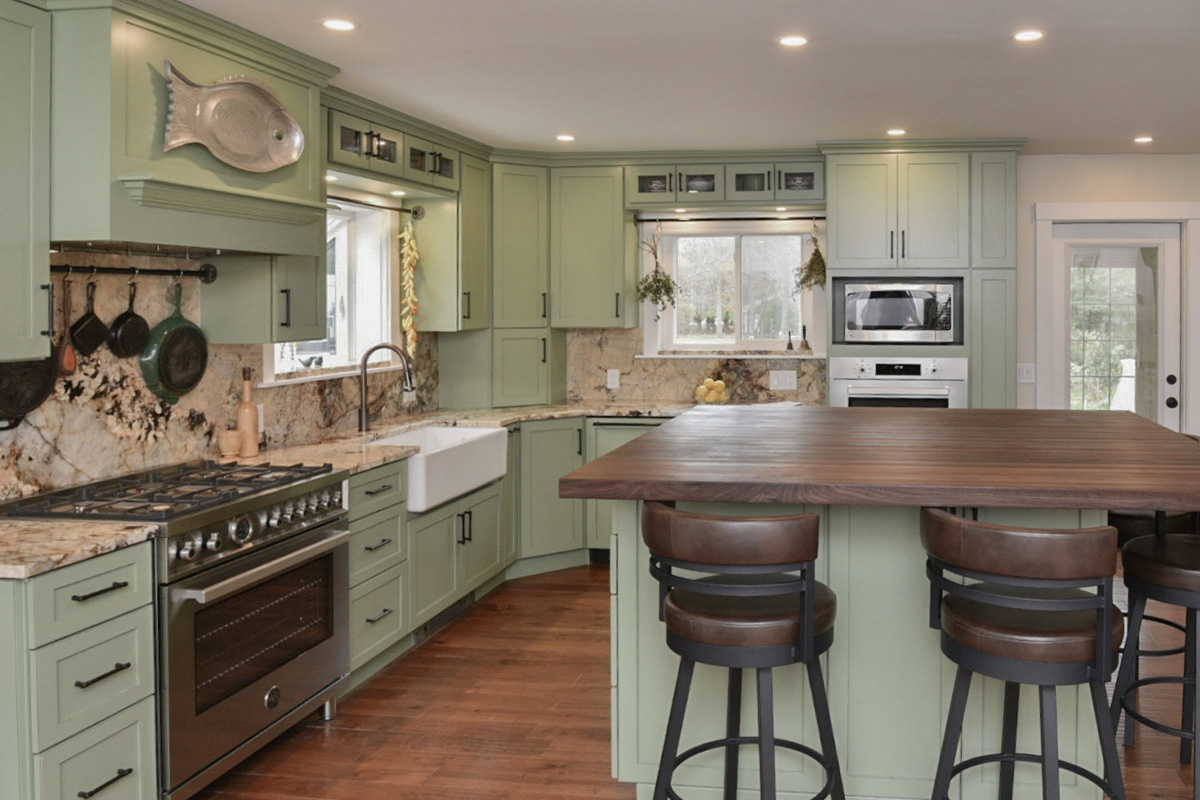 Painted kitchen cabinets in a mint green color.