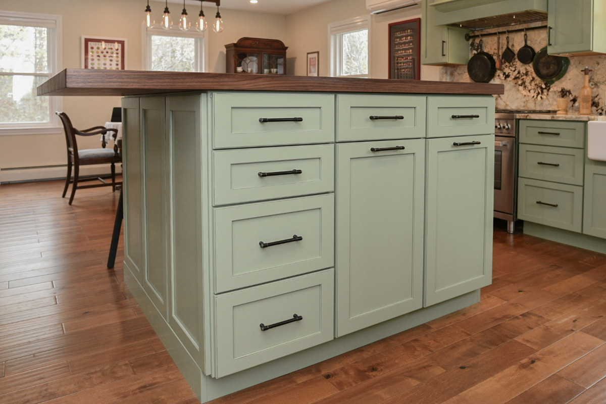 Painted kitchen cabinets in a mint green color.