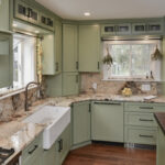 Painted kitchen cabinets in a mint green color.