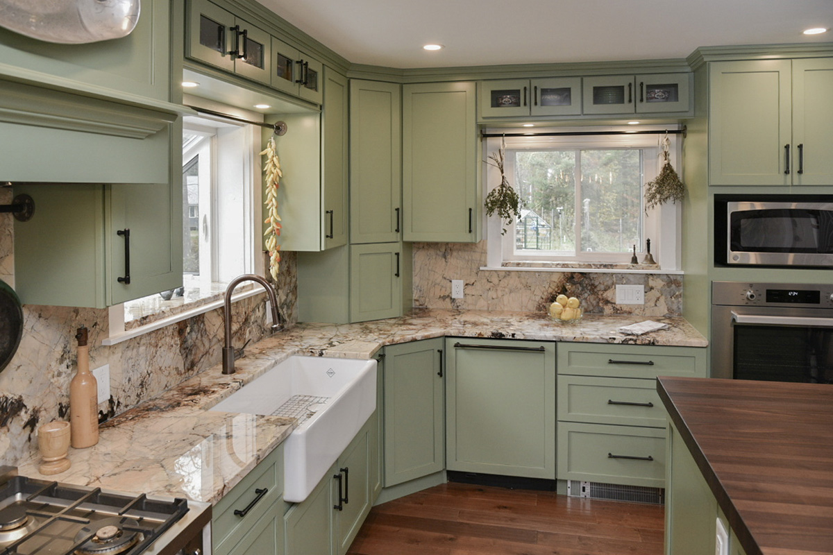 Painted kitchen cabinets in a mint green color.
