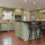 Painted kitchen cabinets in a mint green color.