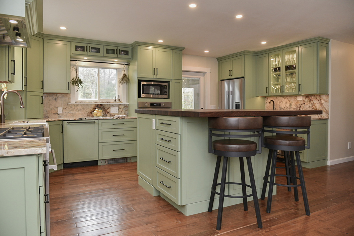 Painted kitchen cabinets in a mint green color.