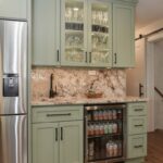 Painted wet bar cabinets in a mint green color.