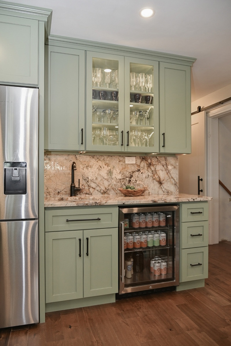 Painted wet bar cabinets in a mint green color.