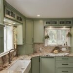Painted kitchen cabinets in a mint green color.