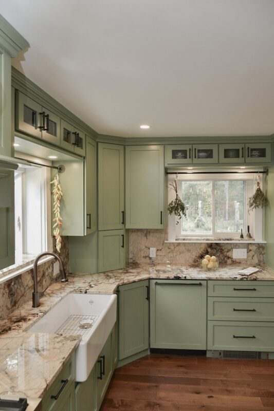 Painted kitchen cabinets in a mint green color.
