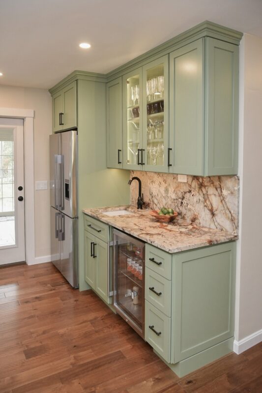 Painted kitchen cabinets in a mint green color.