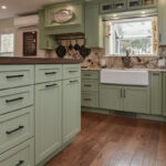 Painted kitchen cabinets in a mint green color.