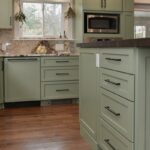 Painted kitchen cabinets in a mint green color.