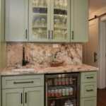 Painted wet bar cabinets in a mint green color.