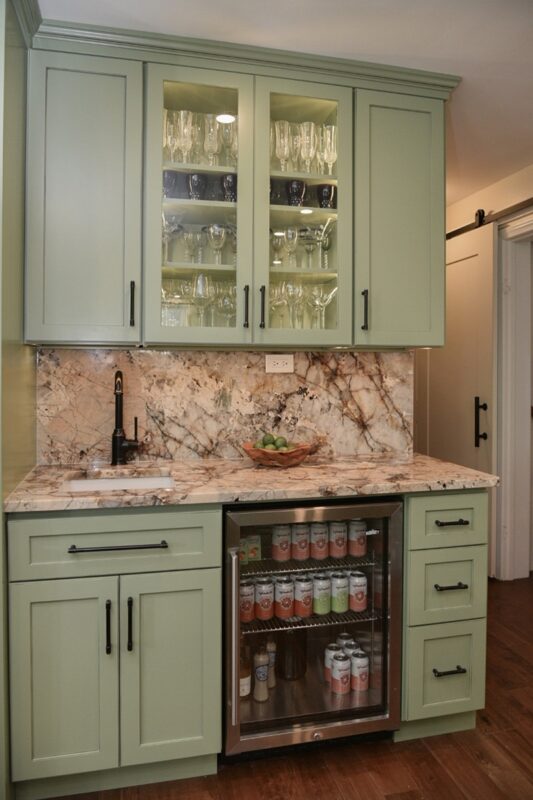 Painted wet bar cabinets in a mint green color.