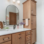 Stained single sink bathroom vanity