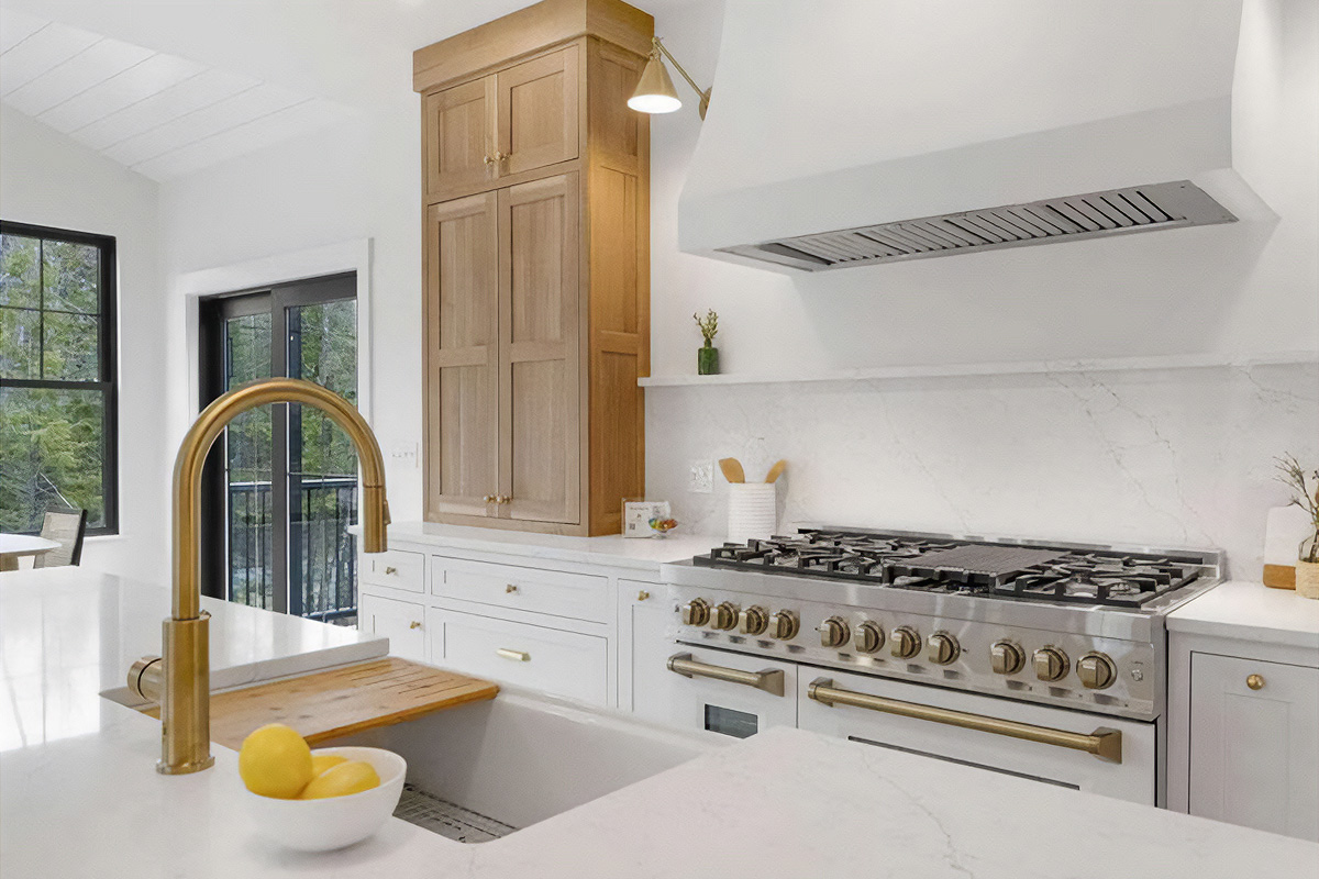 White painted kitchen cabinets with natural wood accent cabinets