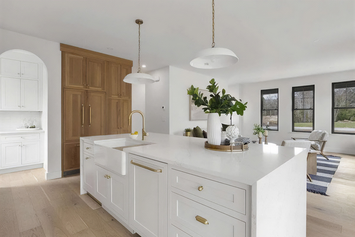 White painted kitchen cabinets with natural wood accent cabinets