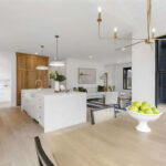 White painted kitchen cabinets with natural wood accent cabinets