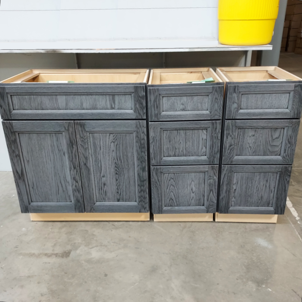 Standard base and two 3-drawer bases in a warehouse finished in a weathered grey finish.