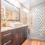 Bathroom with maple midnight-stained cabinets