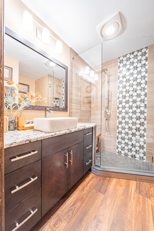 Bathroom with maple midnight-stained cabinets