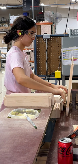 Woman putting together cabinet door parts