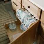 Food storage container organization accessory in a base cabinet.