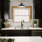 Black painted kitchen cabinets.