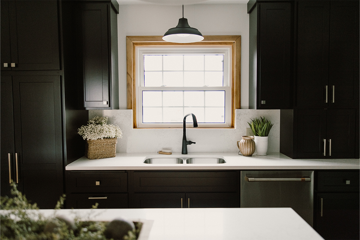 Black painted kitchen cabinets.