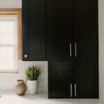 Black painted kitchen cabinets.