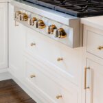 White kitchen cabinet with cooktop range