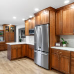 Stained kitchen cabinets with fridge