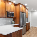 Stained kitchen cabinets with fridge