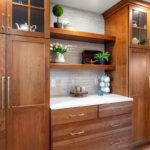 Stained kitchen cabinets with floating shelves