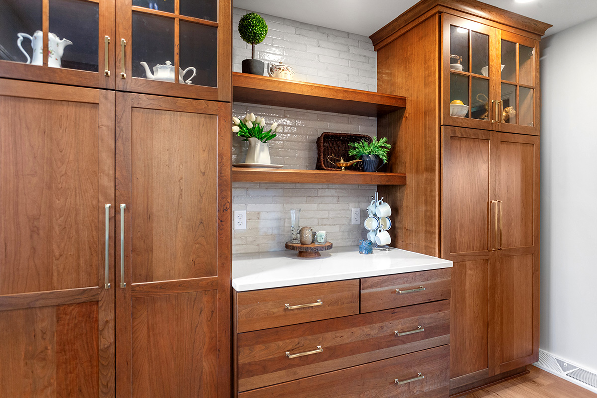 Stained kitchen cabinets with floating shelves