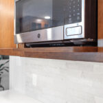 Microwave mounted in a cabinet