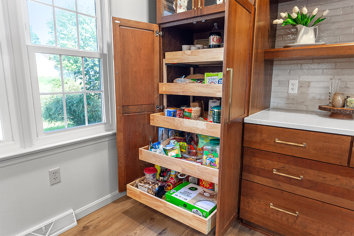 Tall utility cabinet with open doors showing roll trays